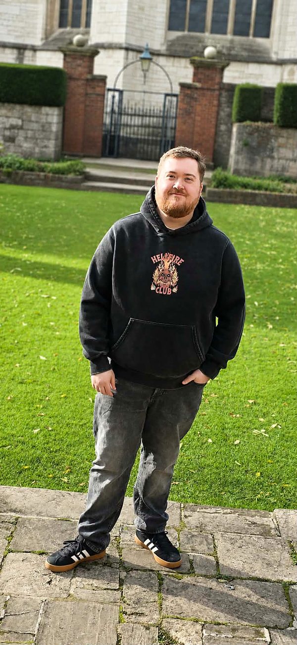 Lewis, who runs Secure-Cloud, standing outside a cathedral in the North West of England